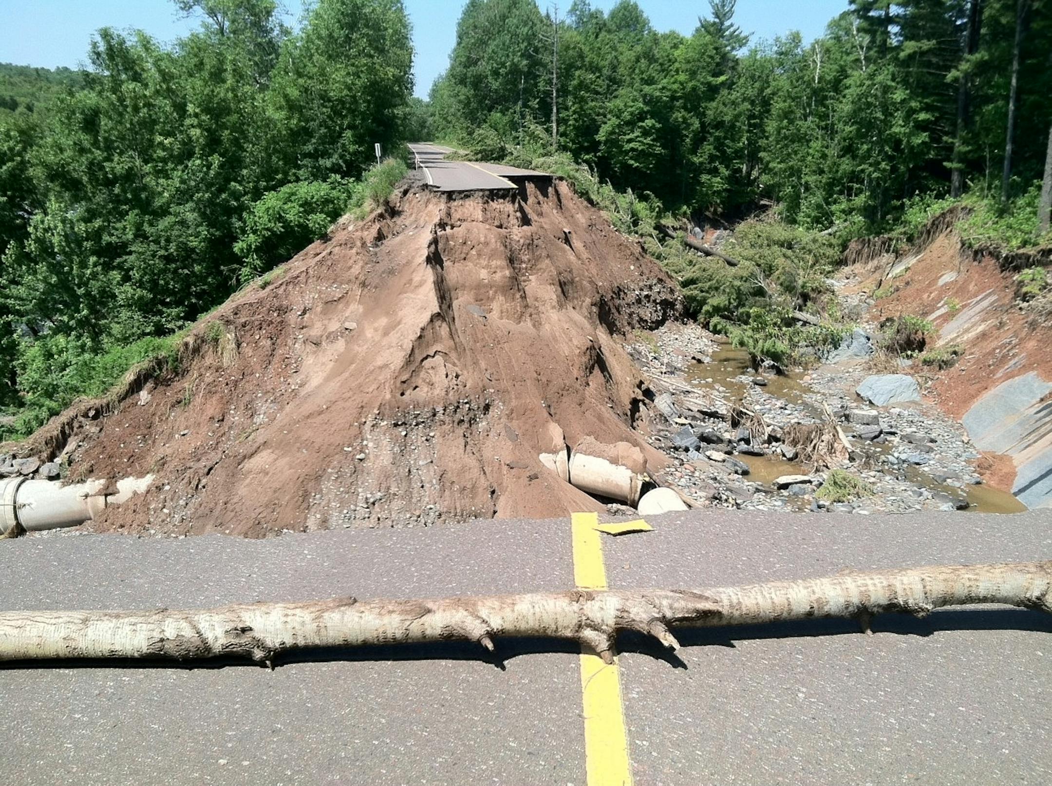 A 35-feet deep trench remains where Hwy. 210 washed out in Jay Cooke State Park in northeastern Minnesota Tuesday, July 3, 2012. The park will remain closed indefinitely due to damage from the recent flooding.