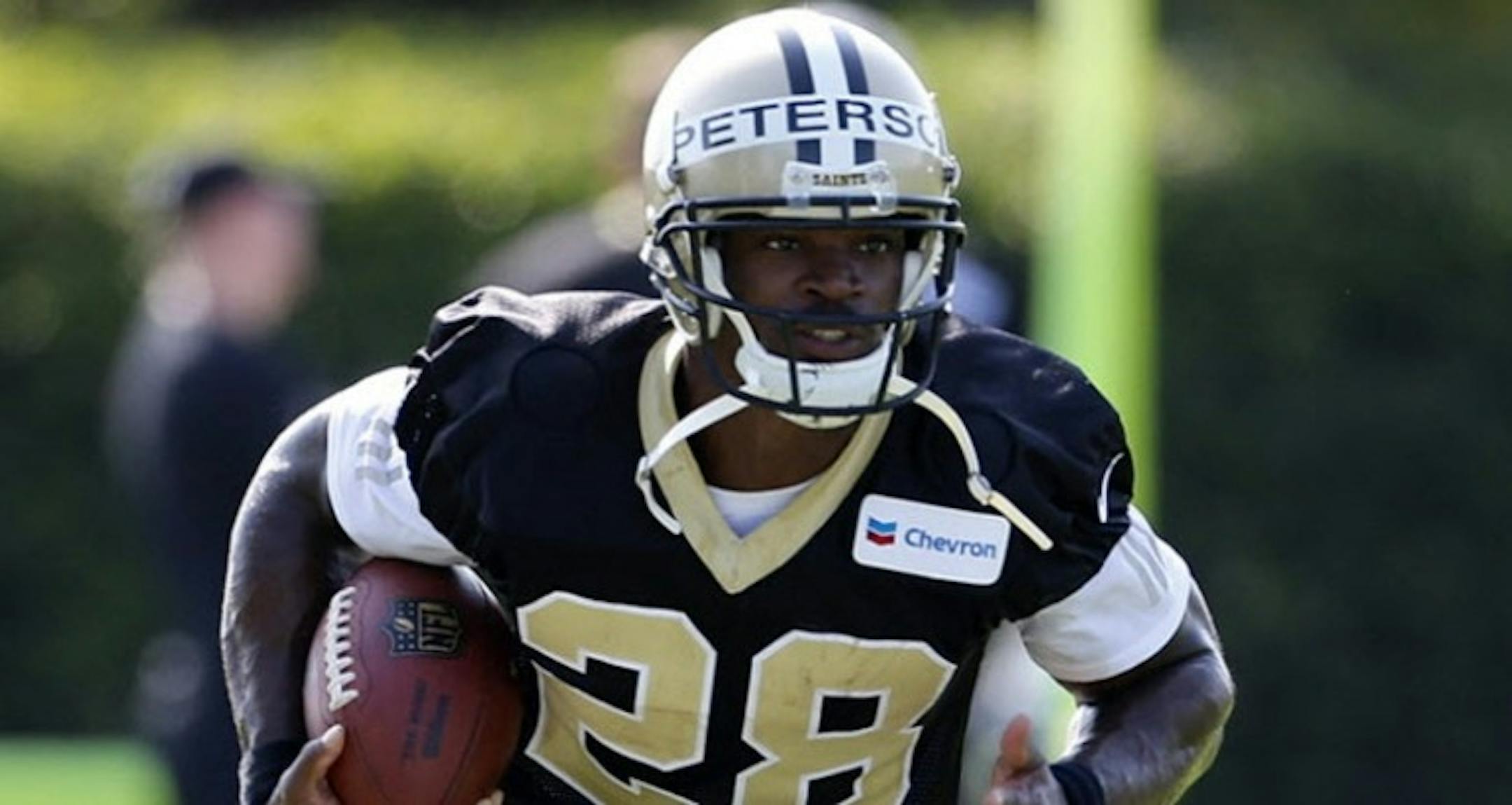Adrian Peterson practices with the Saints.
