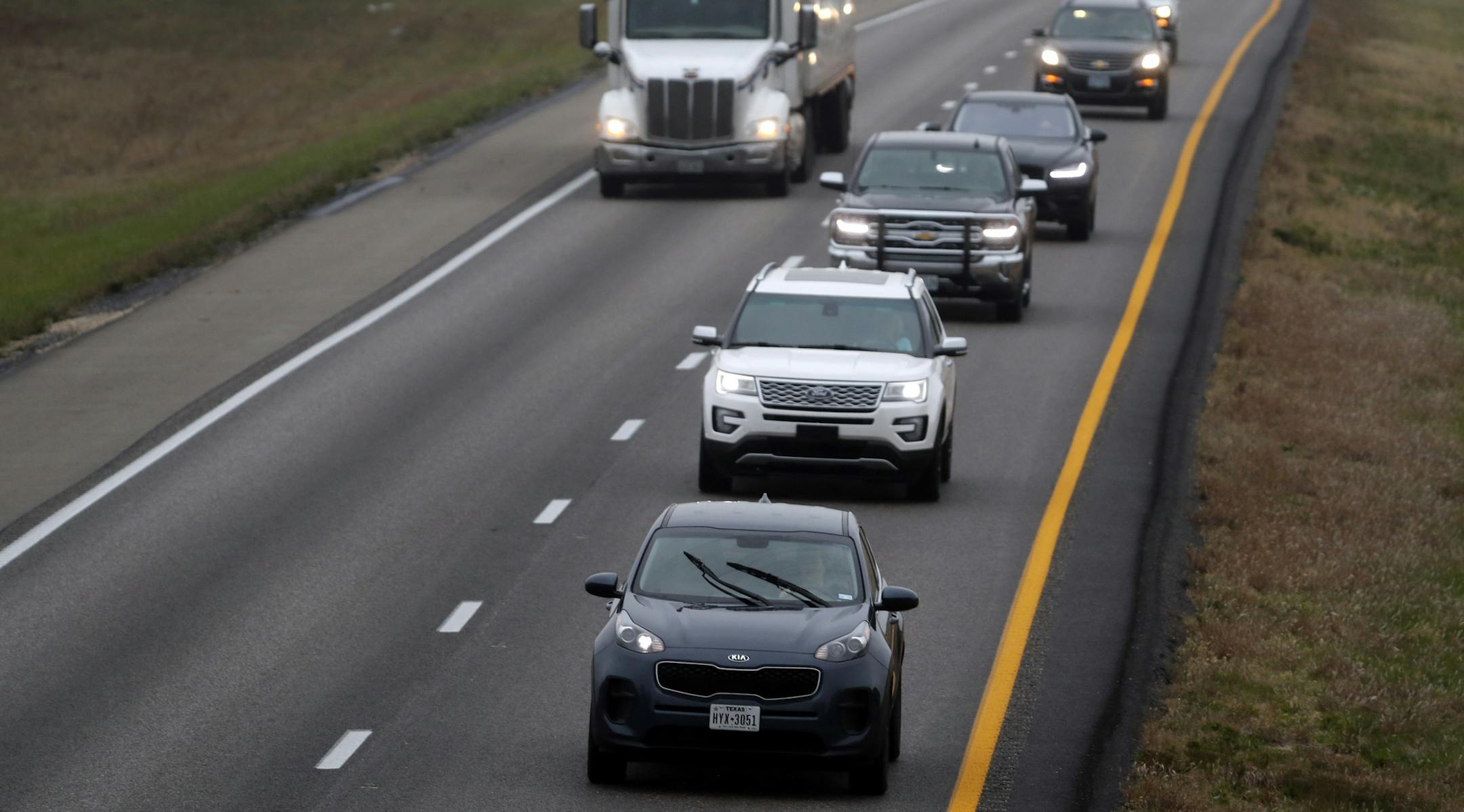 In this photo made Wednesday, Nov. 1, 2017, a driver stays in the passing lane as traffic accumulates behind along I-70 in Montgomery County, Mo. Many states have laws against driving in the left lane except for passing or turning left, which are often ignored by drivers, leading to annoying and dangerous bottlenecks that some experts say are as bad as driving too fast because people get trapped behind and become frustrated prompting some to drive more aggressively. (AP Photo/Jeff Roberson)