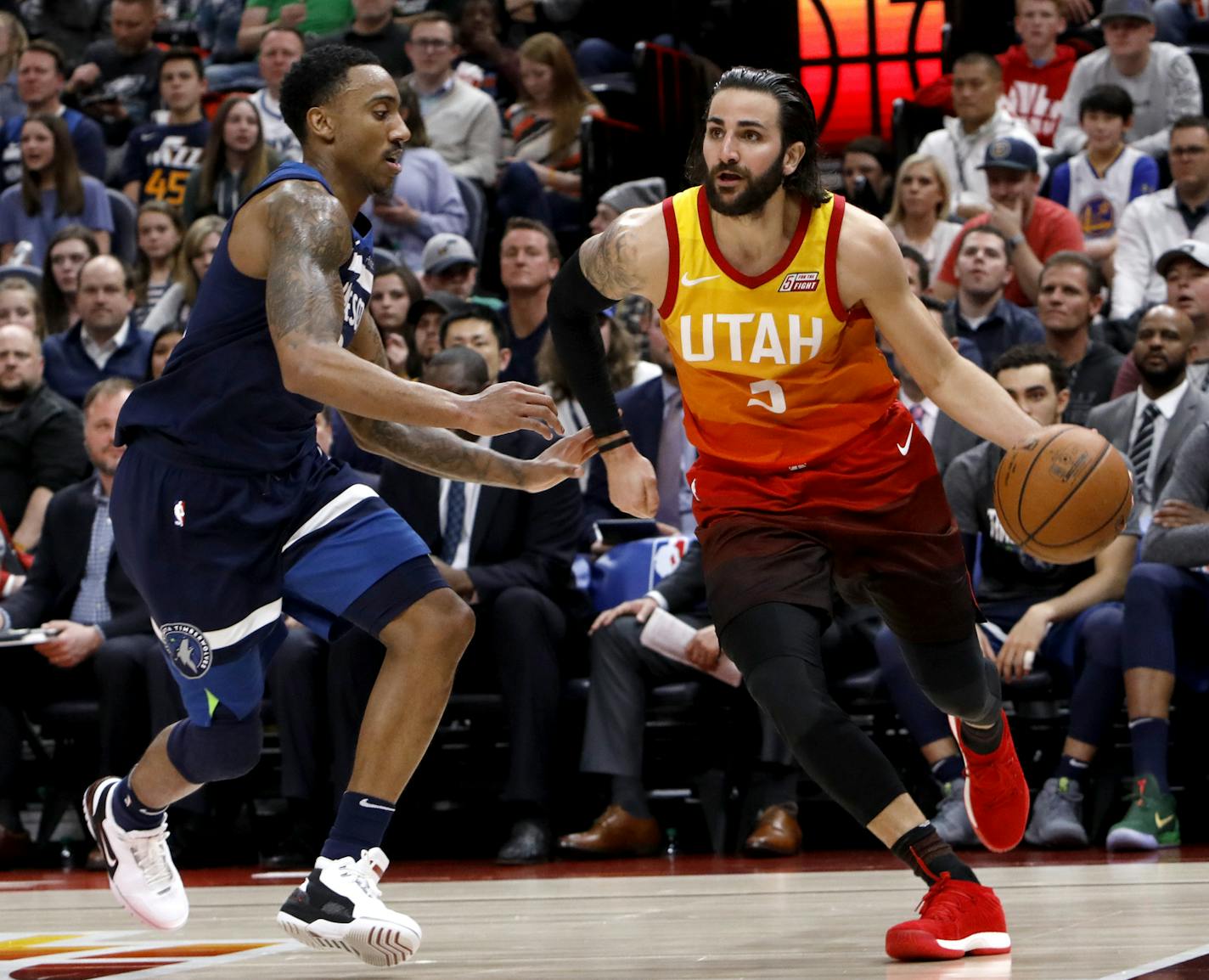 Utah Jazz's Ricky Rubio (3) drives to the basket as Minnesota Timberwolves' Jeff Teague, left, defends in the second half of an NBA basketball game Friday, March 2, 2018, in Salt Lake City. The Jazz went on to win 116-108. (AP Photo/Kim Raff)