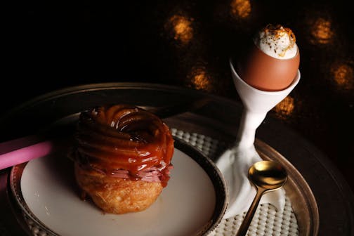 Chicken Liver filled Paris Brest with Black Honey Glaze and Foie Gras Royale with Crème Gitanes. ] ANTHONY SOUFFLE • anthony.souffle@startribune.com Restaurant review of the Grand Cafe with chef Jamie Malone and chef de cuisine Alan Hlaeben Friday, Dec. 8, 2017 in Minneapolis.