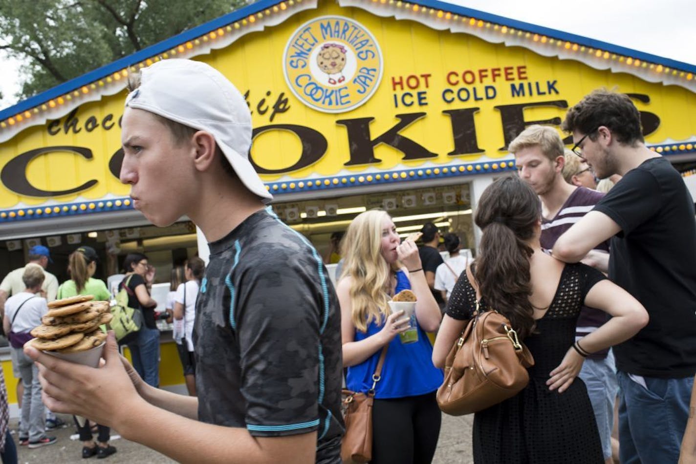 Patrons ate chocolate chip cookies outside Sweet Martha's Cookie Jar Thursday.