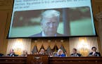 A tweet by then-President Donald Trump is displayed on a screen during the first public hearing before the House committee investigating the Jan. 6 at
