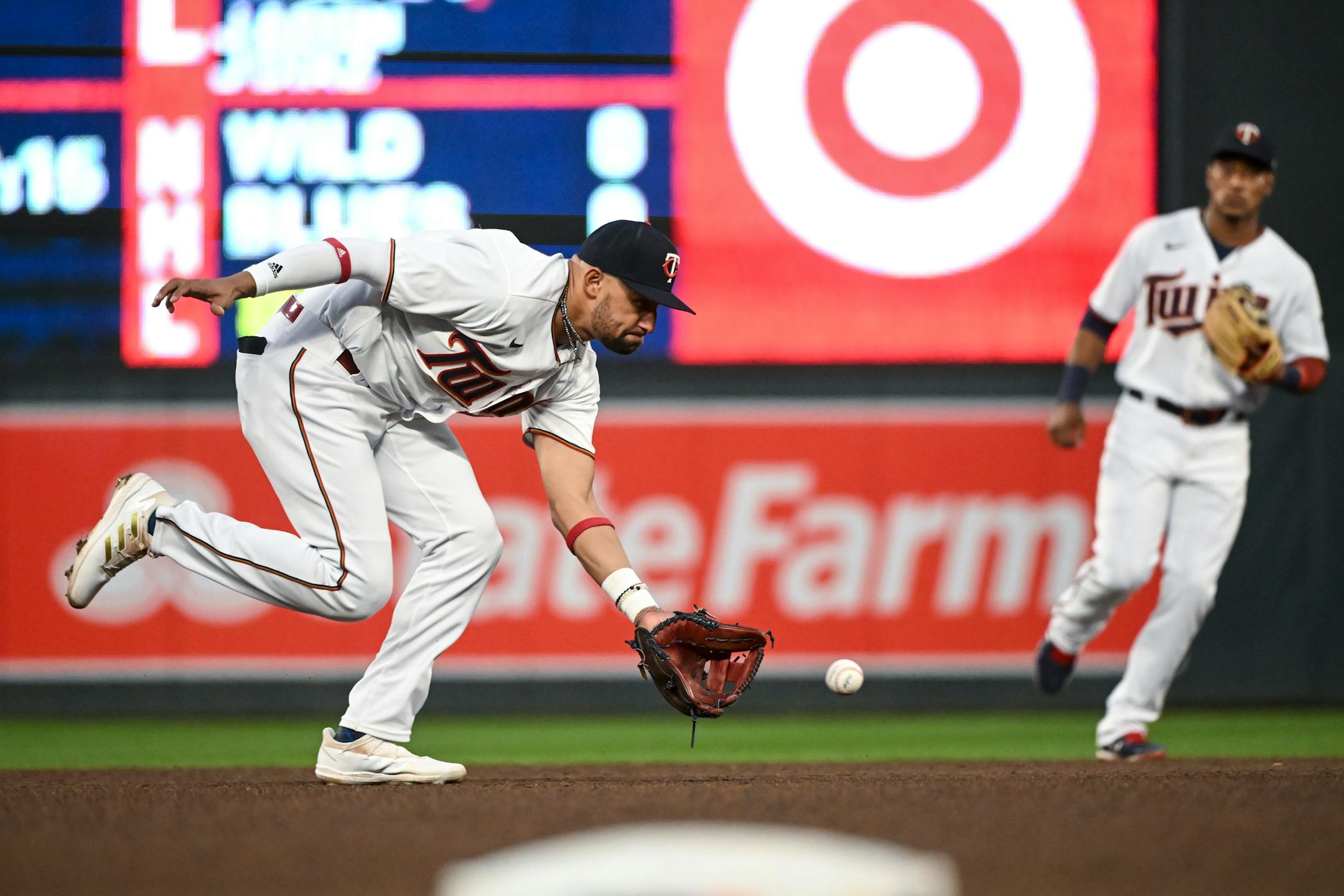 Minnesota Twins shortstop Royce Lewis (23) fields a ball hit by Oakland Athletics shortstop Elvis Andrus (17) before throwing Andrus out at first during the top of the fifth inning.
