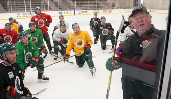 Wild players listened as head coach Bruce Boudreau spoke during a practice on Sept 13.