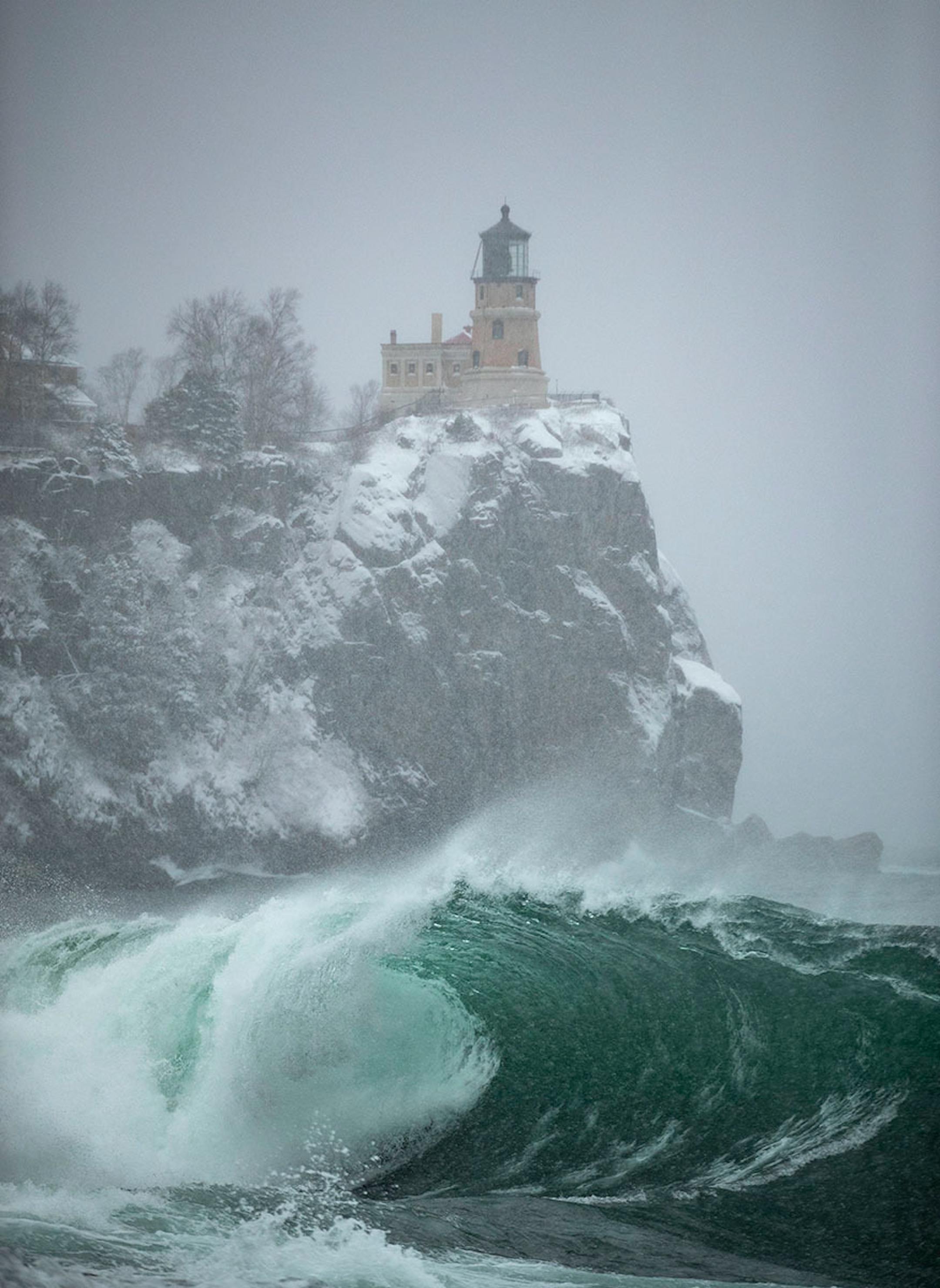 Massive waves crashed on the shoreline by the Split Rock Lighthouse in Two Harbors as snow fell on Wednesday Nov. 27. 2019.