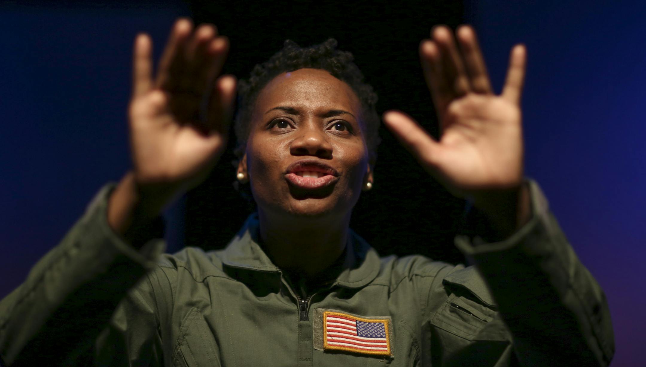 Sha Cage in "Grounded" during a dress rehearsal Monday night. ] JEFF WHEELER ‚Ä¢ jeff.wheeler@startribune.com Sha Cage in "Grounded," is the star and only actor in George Brant's new play about a female fighter pilot whose career is interrupted by a pregnancy. Cage plays a pilot who becomes a drone operator, working in the arid landscape outside of Las Vegas to eliminate bad guys 8,000 miles away in the sands of the Middle East. Wendy Knox of Frank Theatre directed the first run