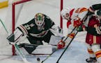 Wild goaltender Cam Talbot stopped a shot by Calgary’s Elias Lindholm on April 28 at Xcel Energy Center.