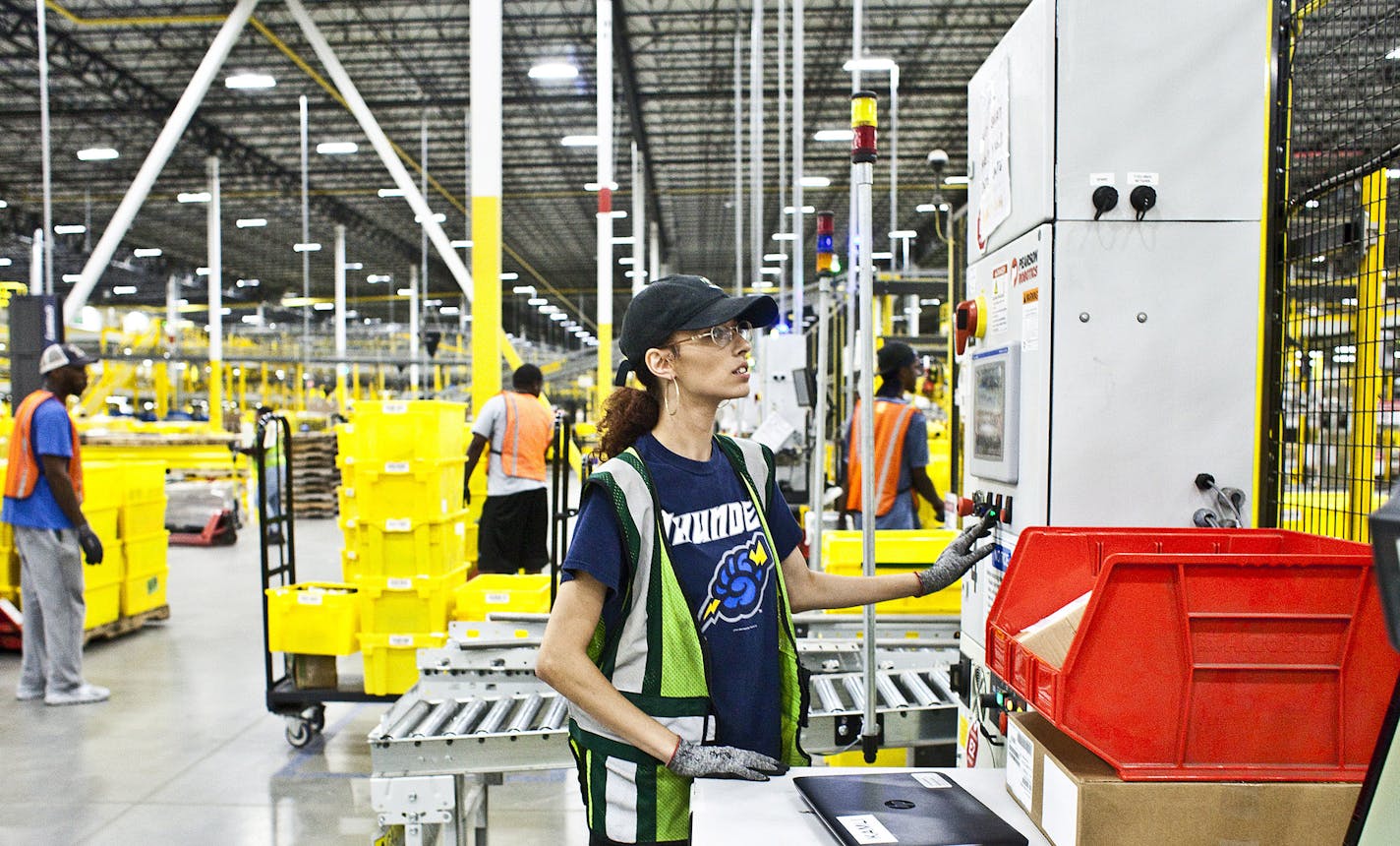 FILE &#xf3; An employee at Amazon's facility in Florence, N.J., Aug. 29, 2017. In a move that could win favor in Washington but cut into profits, Amazon will raise the minimum wage for all of its employees in the United States to $15 an hour, it announced on Oct. 2, 2018. (Bryan Anselm/The New York Times)