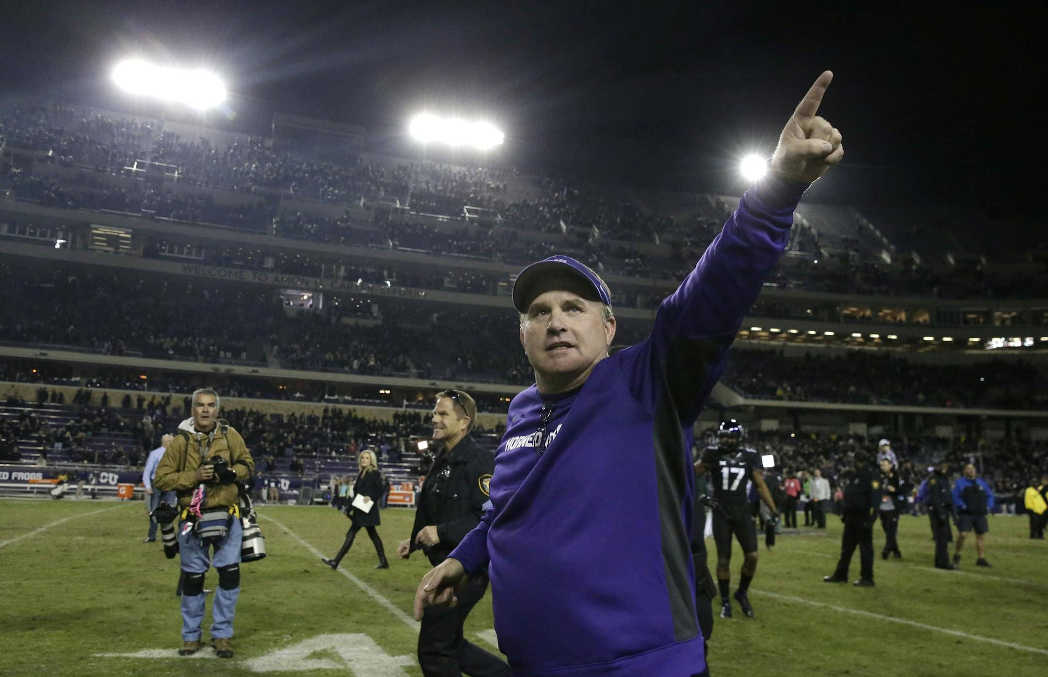TCU head coach Gary Patterson points to fans as he runs off the field after an NCAA college football game against Kansas State Saturday, Nov. 8, 2014, in Fort Worth, Texas. TCU won 41-20. (AP Photo/LM Otero) ORG XMIT: TXMO126