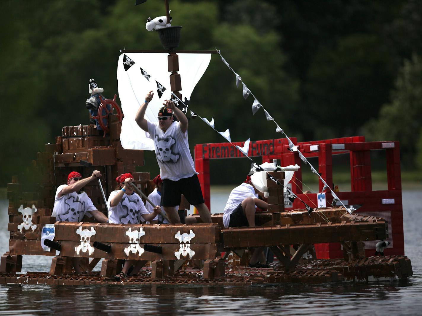 The Pirates of the Cow-ribbean milk carton boat competes in the final race of the afternoon Sunday at Lake Calhoun Park. ] The Best Days of Summer Aquatennial Milk Carton Boat race was held Sunday afternoon at Thomas Beach on Lake Calhoun. The annual aquatennial continues through July 26th. MONICA HERNDON monica.herndon@startribune.com Minneapolis, MN 07/20/14