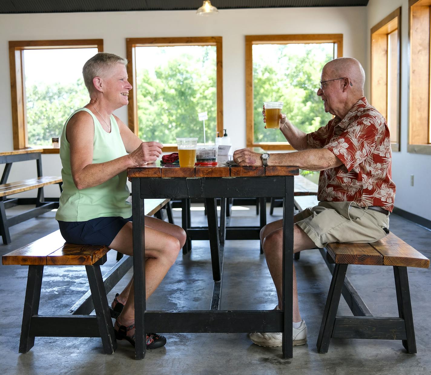 Nancy and Buzz Pedersen, of Apple Valley, enjoyed their beers, the "2 Day Weekend" and "T-1," respectively, in Tilion's brew hall Thursday afternoon. The Pedersens were early investors in the brewery and regularly visit now that they spend more time in their camper parked nearby.