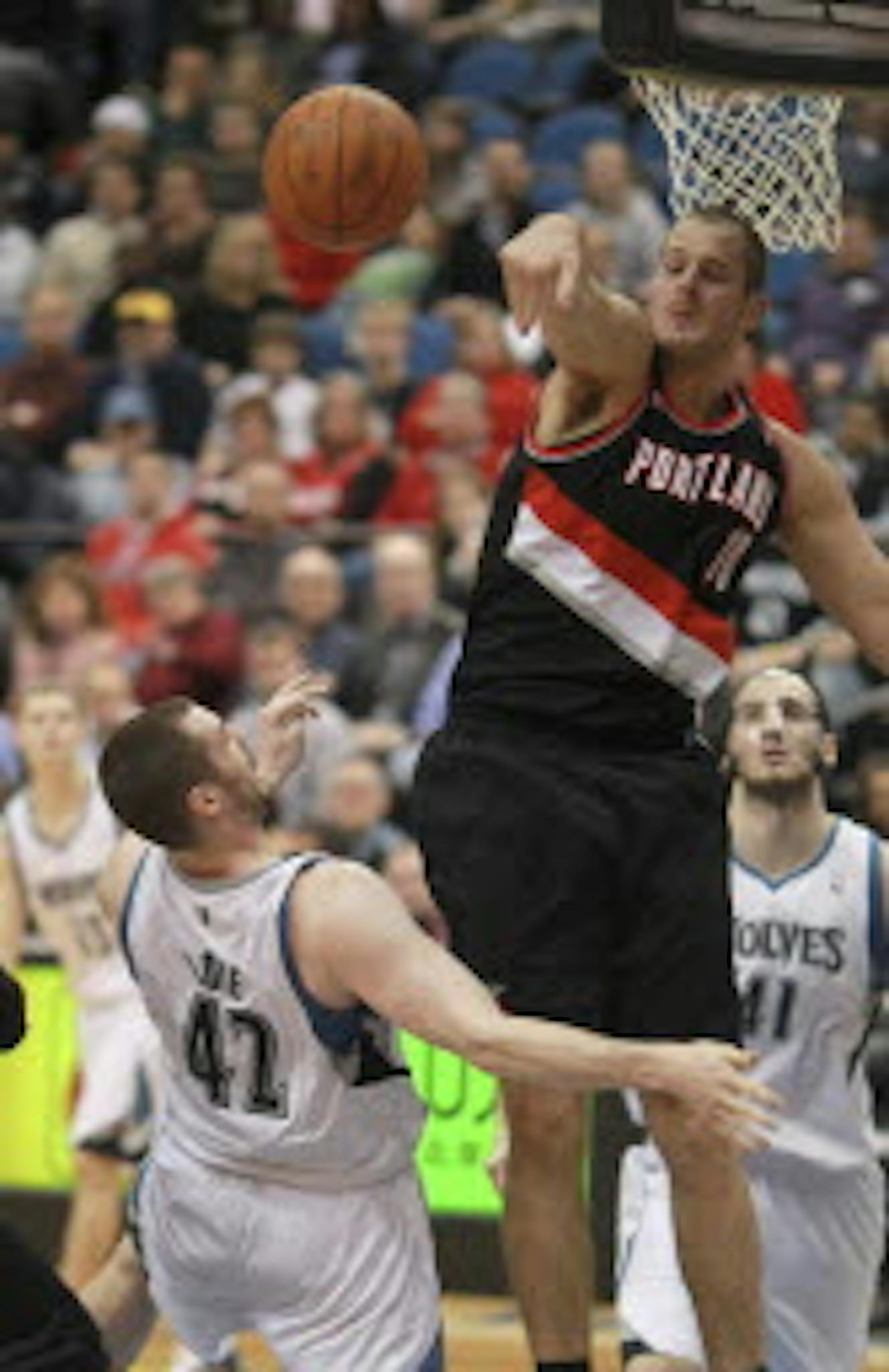 Portland's Joel Przybilla swatted away a second-quarter shot by the Wolves' Kevin Love in a Feb. 2011 game at Target Center. The 7-1 center agreed to a one-year deal with the Bucks on Monday night.