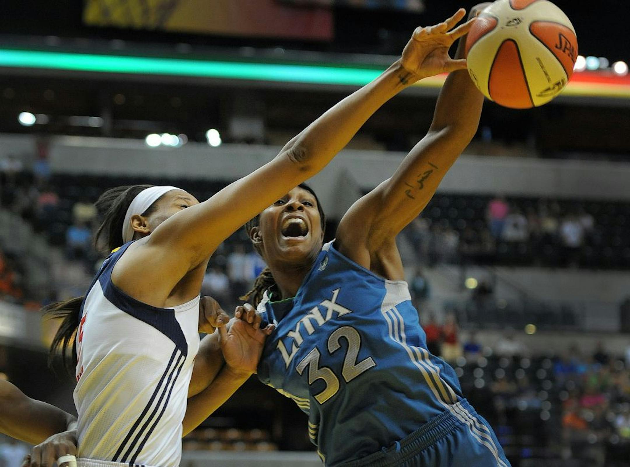 The Lynx's Rebekkah Brunson (right) and Indiana's Jessica Davenport battled for a rebound.