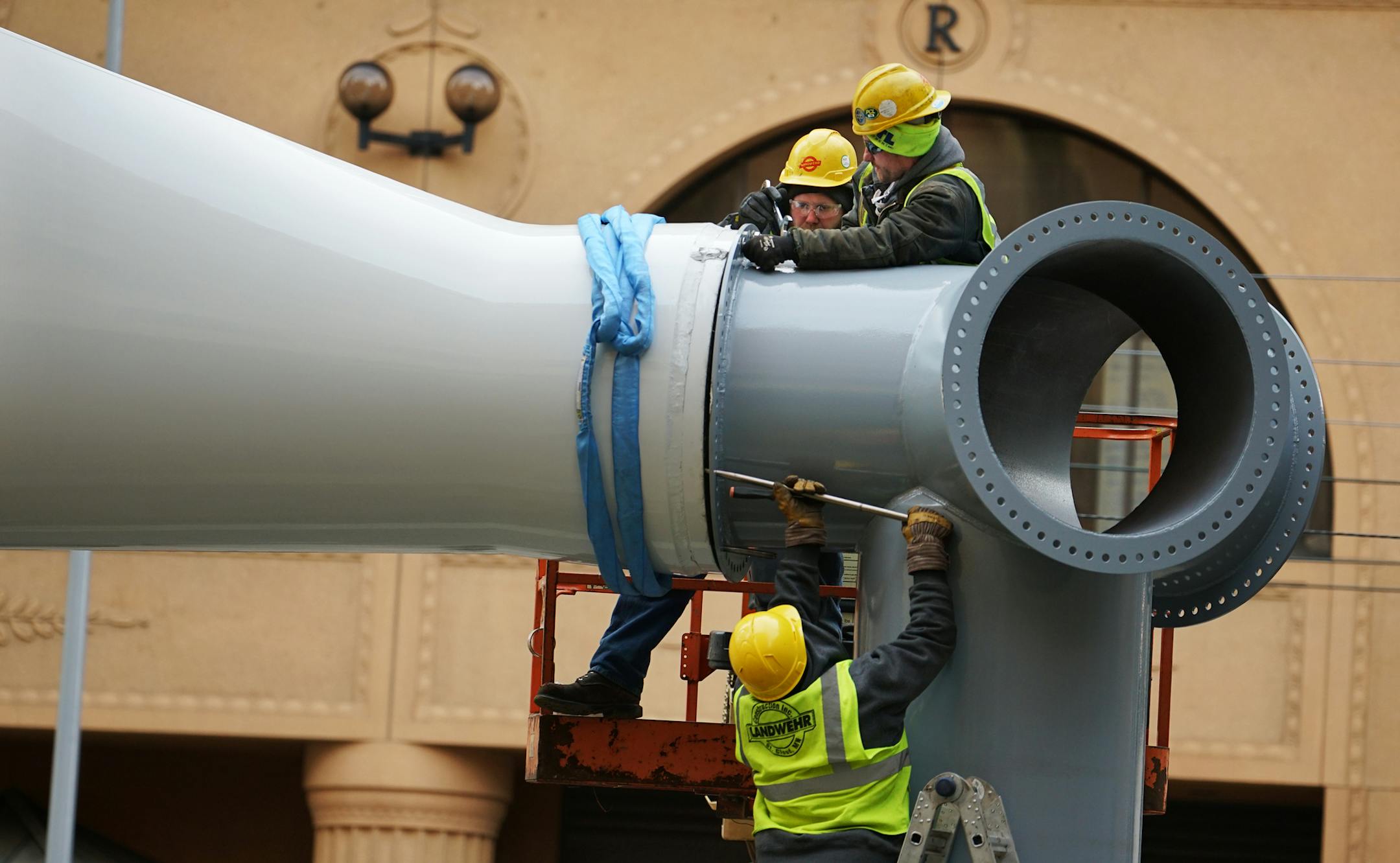 Xcel installs a real wind turbine blade outside its headquarters on Nicolllet Mall in a commerce as display in time for the Super Bowl.] Richard Tsong-Taatarii/rtsong-taatarii@startribune.com