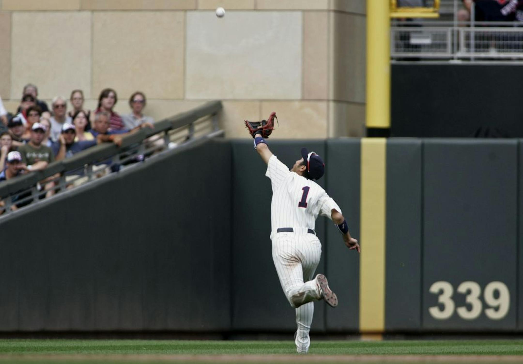 Twin Tsuyoshi Nishioka chased down a fly boy by Detroit's Victor Martinez in the ninth inning at Target Field in Minneapolis , Minn., Saturday, July 23, 2011.