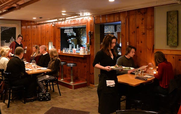 Diners enjoy the rustic pine decor in the main dining room of 128 Cafe. ] (SPECIAL TO THE STAR TRIBUNE/BRE McGEE)