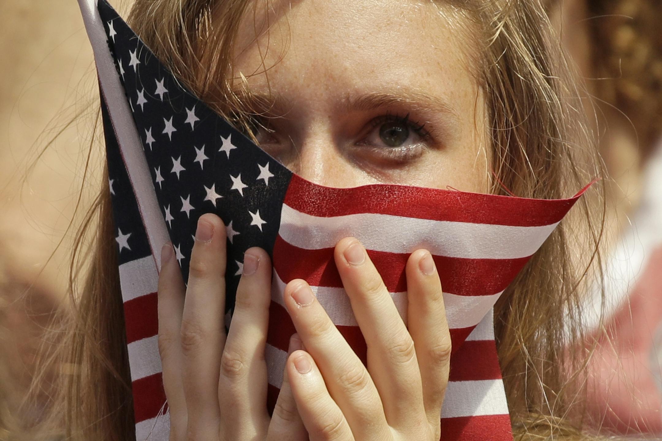A fan watches the final moments of the 2019 FIFA Women's World Cup soccer final between between the United States and the Netherlands Sunday, July 7, 2019, in Kansas City, Mo. The United States won 2-0.