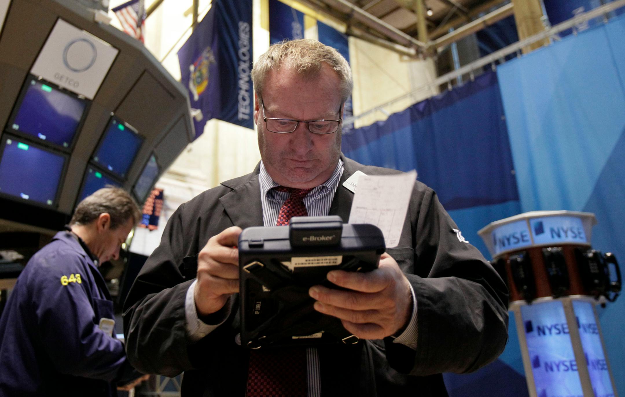 Trader Douglas Glander works on the floor of the New York Stock Exchange.