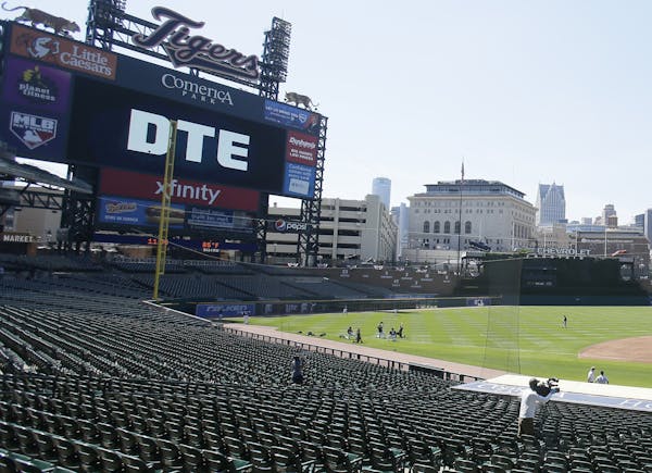 Detroit Tigers players work out during baseball training camp at Comerica Park Friday, July 3, 2020, in Detroit. (AP Photo/Duane Burleson)