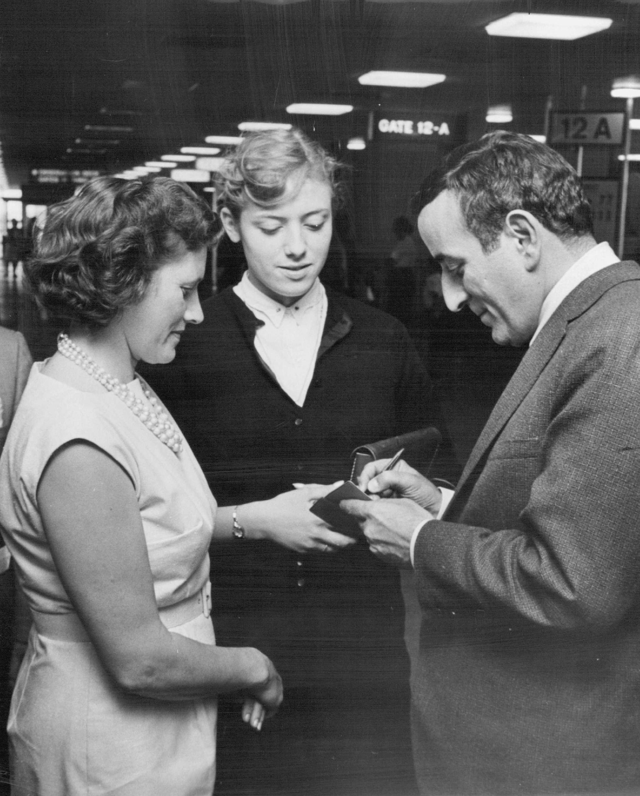 Mrs. Leon Christiansen, left, daughter, Karen. Singer Tony Bennett arrived on Wednesday, Aug. 19, 1964 in Minneapolis smiling gamely about playing a supermarket and a ball park. "There 's a first time for everything," Bennett said about his appearance at the Red Owl Store in Coon Rapids, Minn.