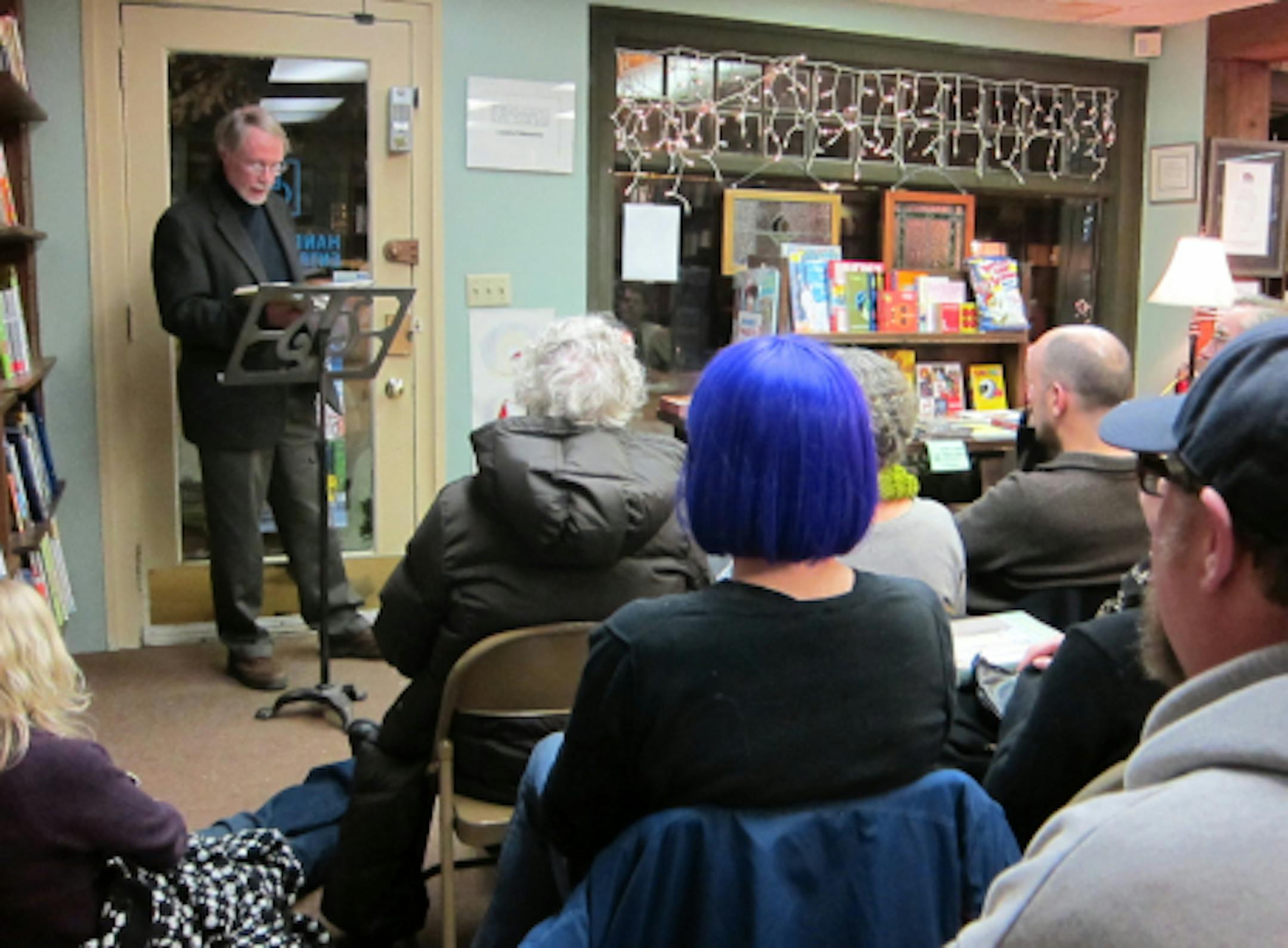 Charles Baxter speaks to a standing-room-only crowd at Micawber's in St. Paul.