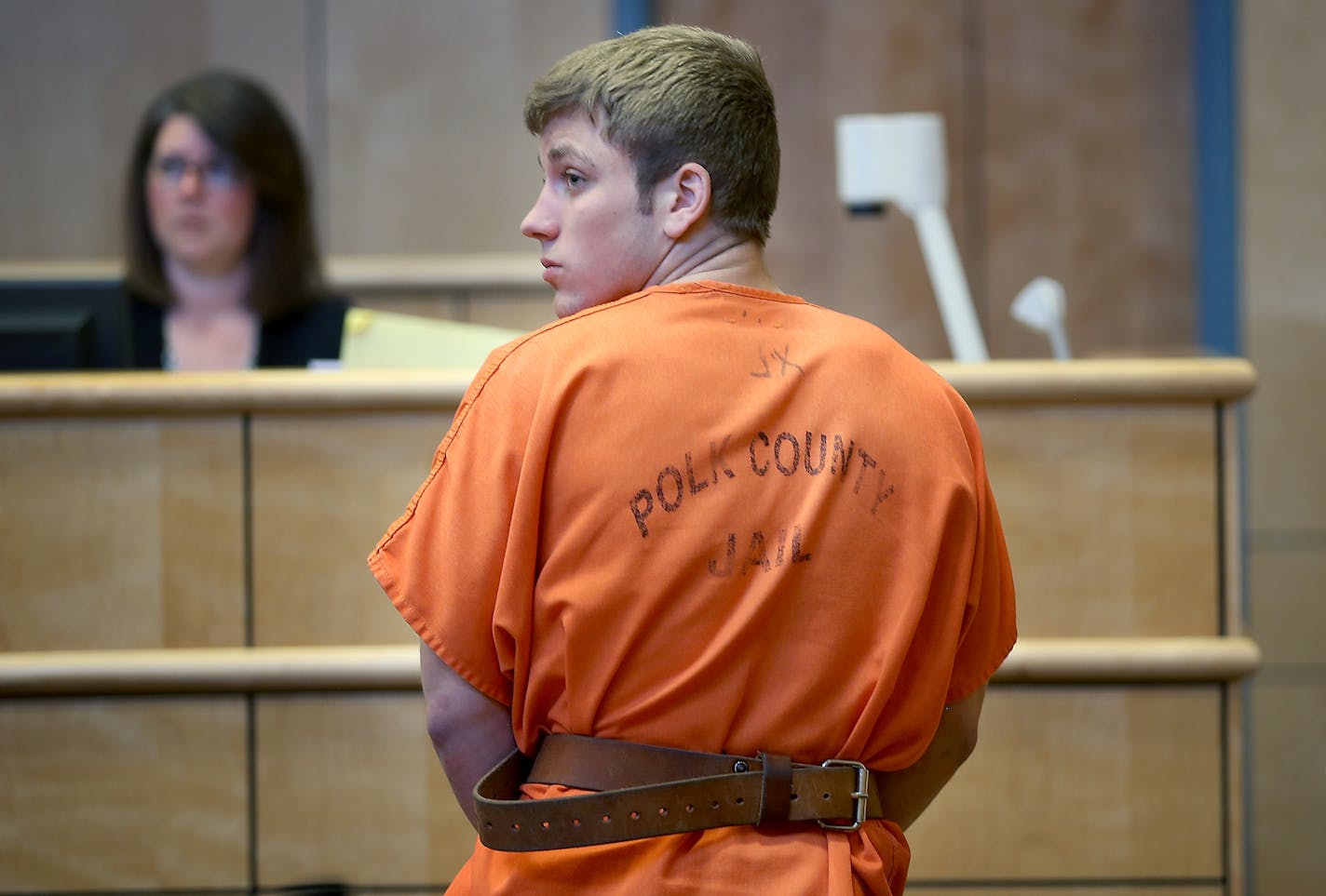 Levi Acre-Kendall looked back toward the court as he made his way out of the Polk County Justice Center courtroom, Wednesday, April 22, 2015 in Balsam Lake, WI.