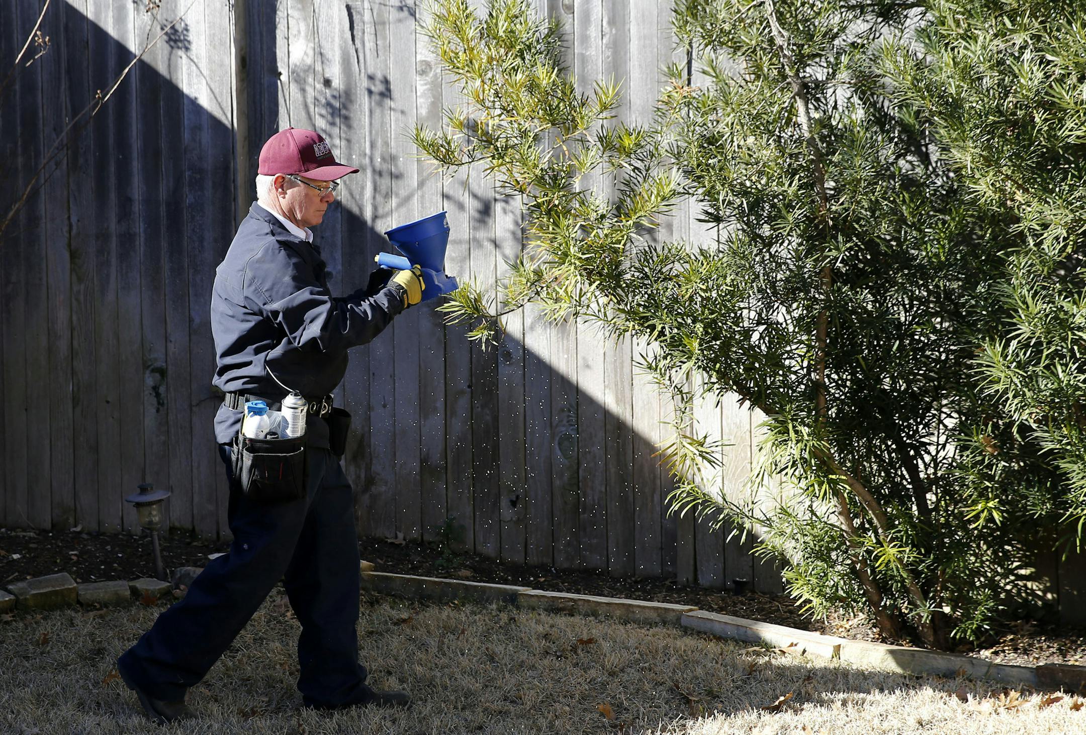 Steve Florsheim of ABC Home and Commercial Services works on preventative pest treatment on Tuesday, January 23, 2018 at a home in Dallas, Texas. (Vernon Bryant/Dallas Morning News/TNS) NO MAGAZINE SALES MANDATORY CREDIT; NO SALES; INTERNET USE BY TNS CONTRIBUTORS ONLY ORG XMIT: 1222340