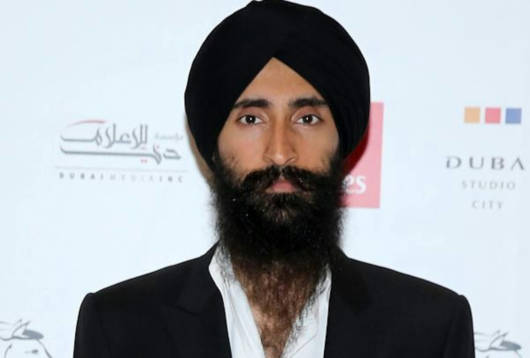 Waris Ahluwalia, an American actor and practicing Sikh, says he was barred from boarding a flight after refusing to remove his turban.