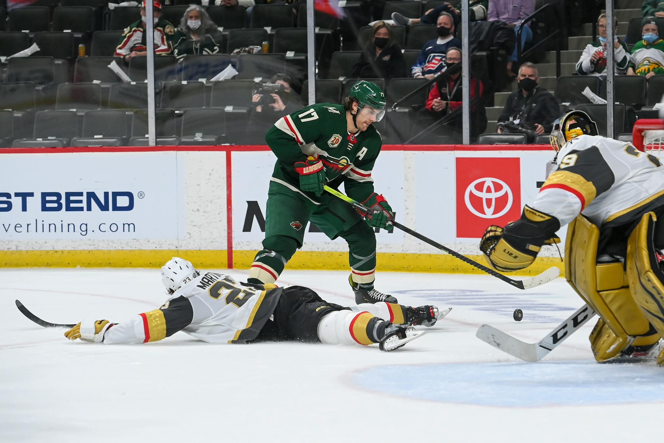Vegas Golden Knights defenseman Alec Martinez (23) slid to the ice to try to block a shot by Minnesota Wild left wing Marcus Foligno (17) in the third period.