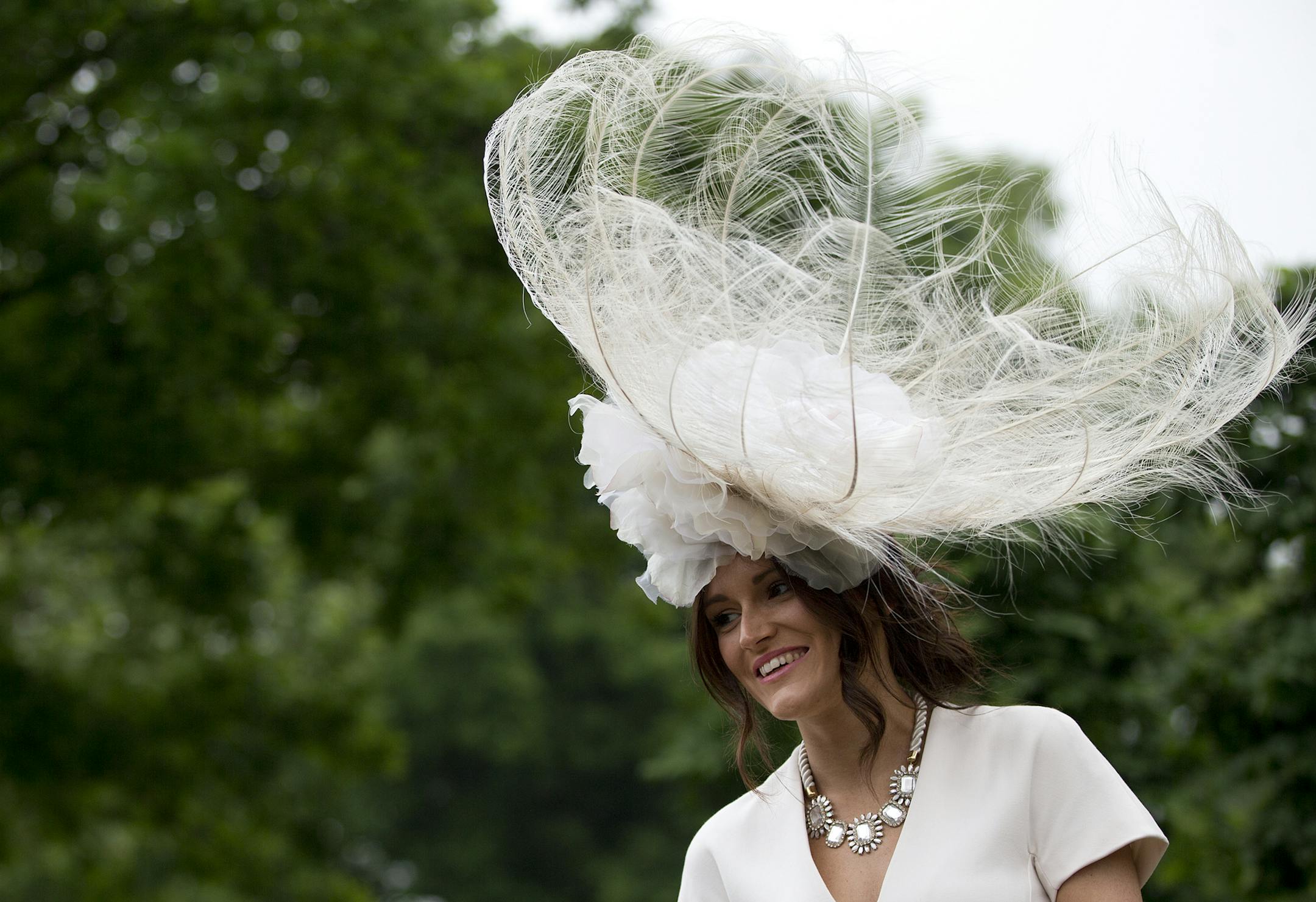 A racegoer wears an ornate hat on the third day traditionally known as Ladies Day of the Royal Ascot horse race meeting in Ascot, England, Thursday, June 20, 2013. (AP Photo/Alastair Grant)
