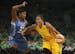 Los Angeles Sparks forward Candace Parker (3) drove the hoop in the first half while defended by Minnesota Lynx forward Rebekkah Brunson (32). She was
