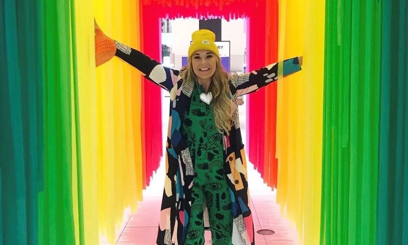 Social influencer Sarah Edwards is pictured walking through an art installation at Rosedale Center. Photo provided by Sarah Edwards