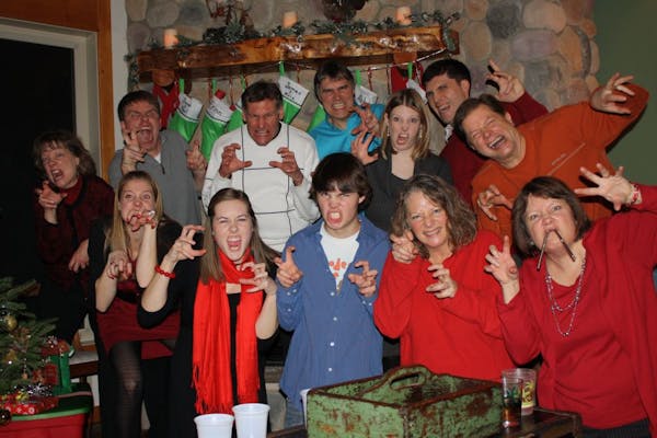 It's not Christmas without the "dinosaur hands" photo for Erinn Danielsen''s family, a tradition that dates to 1997.
