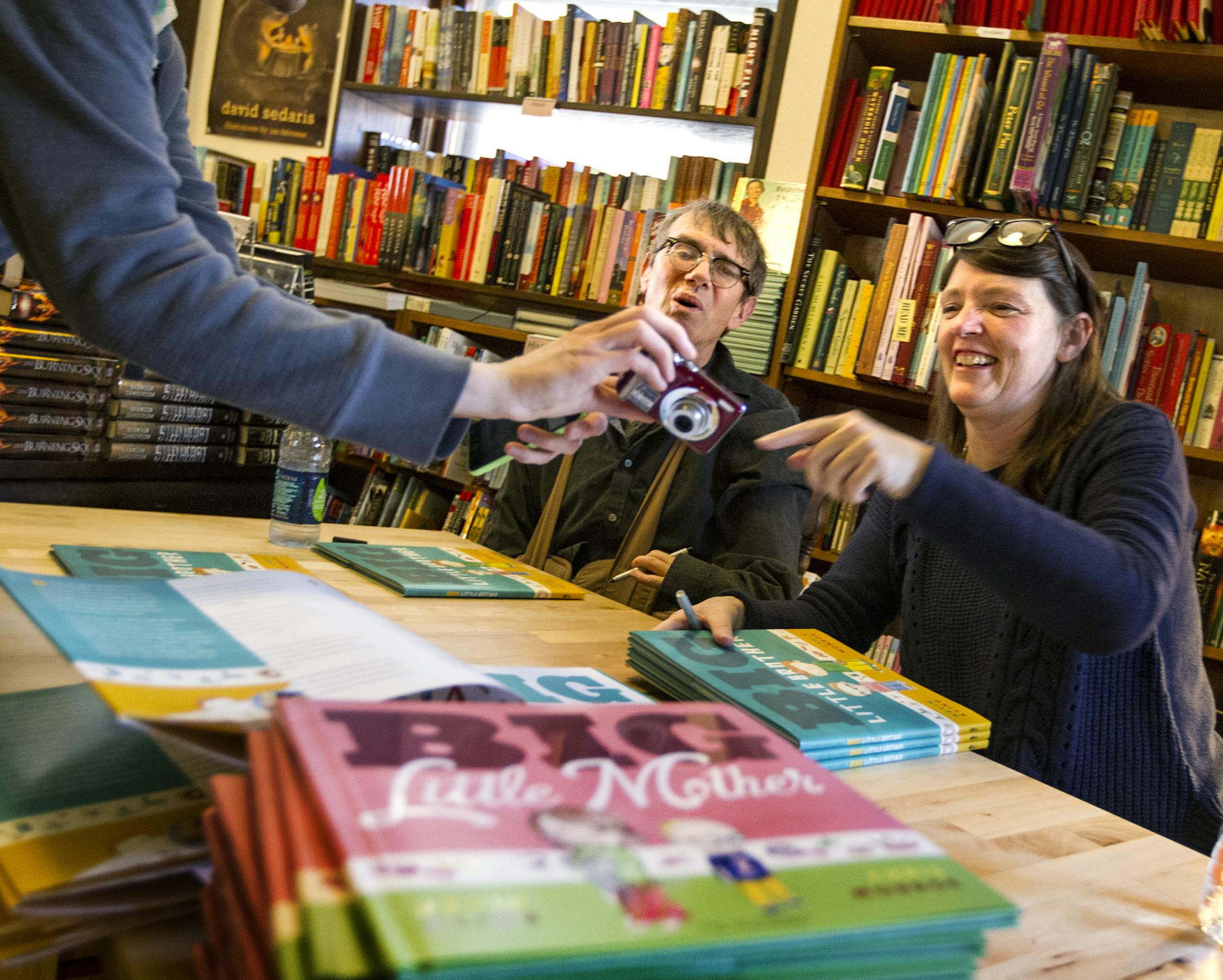 Kevin Kling, left, and Chris Monroe posed for photos, read, and signed their second picture book, "Big Little Mother!" at Wild Rumpus Bookstore in Linden Hills November 2, 2013. (Courtney Perry/Special to the Star Tribune)