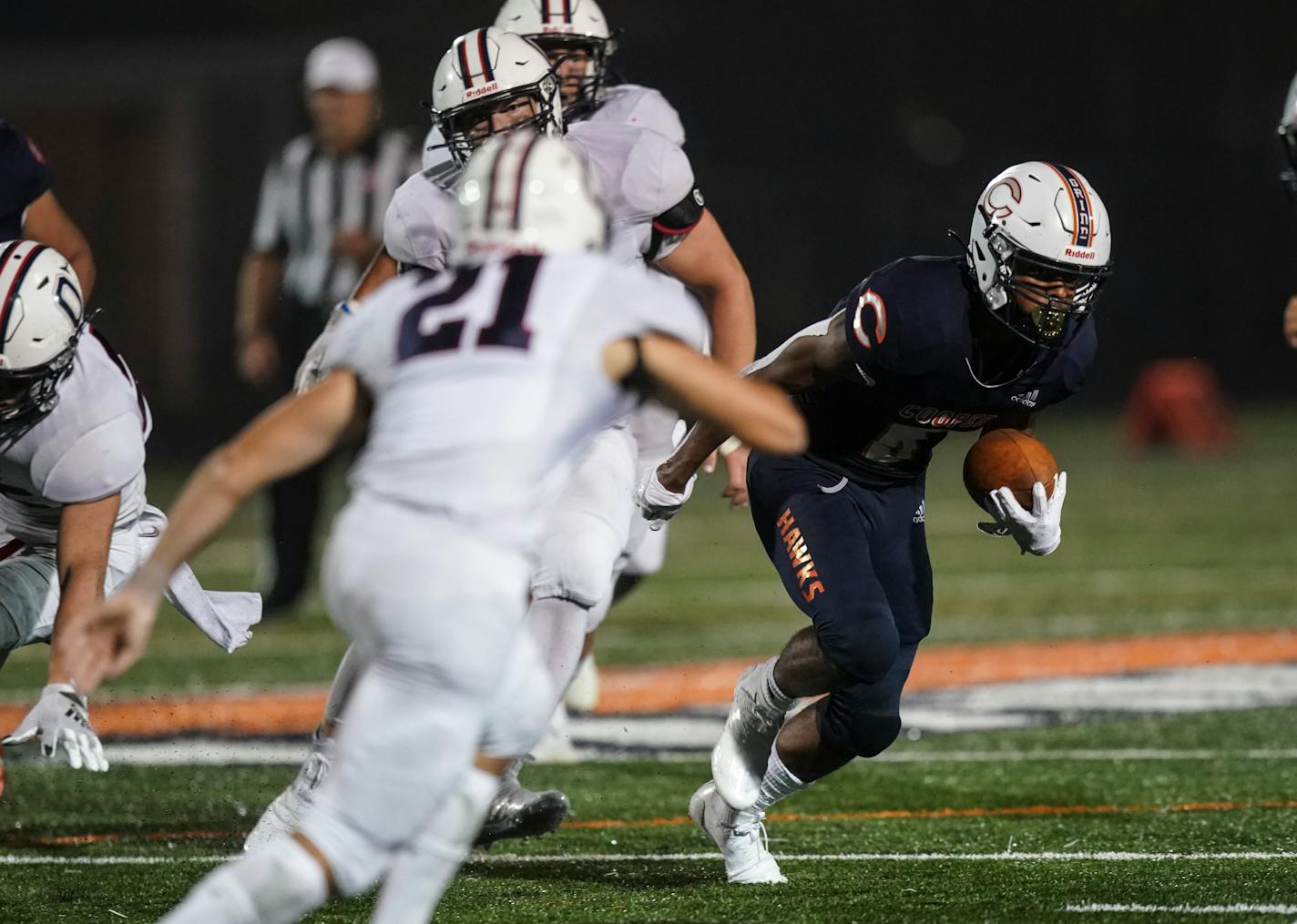 Cooper High School Camden Royal (6) wound his way around Orono's defense for a first down in the fourth quarter. Cooper defeated Orono, 43-27.