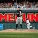 Chicago White Sox starting pitcher Derek Holland stands on the mound as Minnesota Twins' Kennys Vargas runs the bases on a three-run home run during t