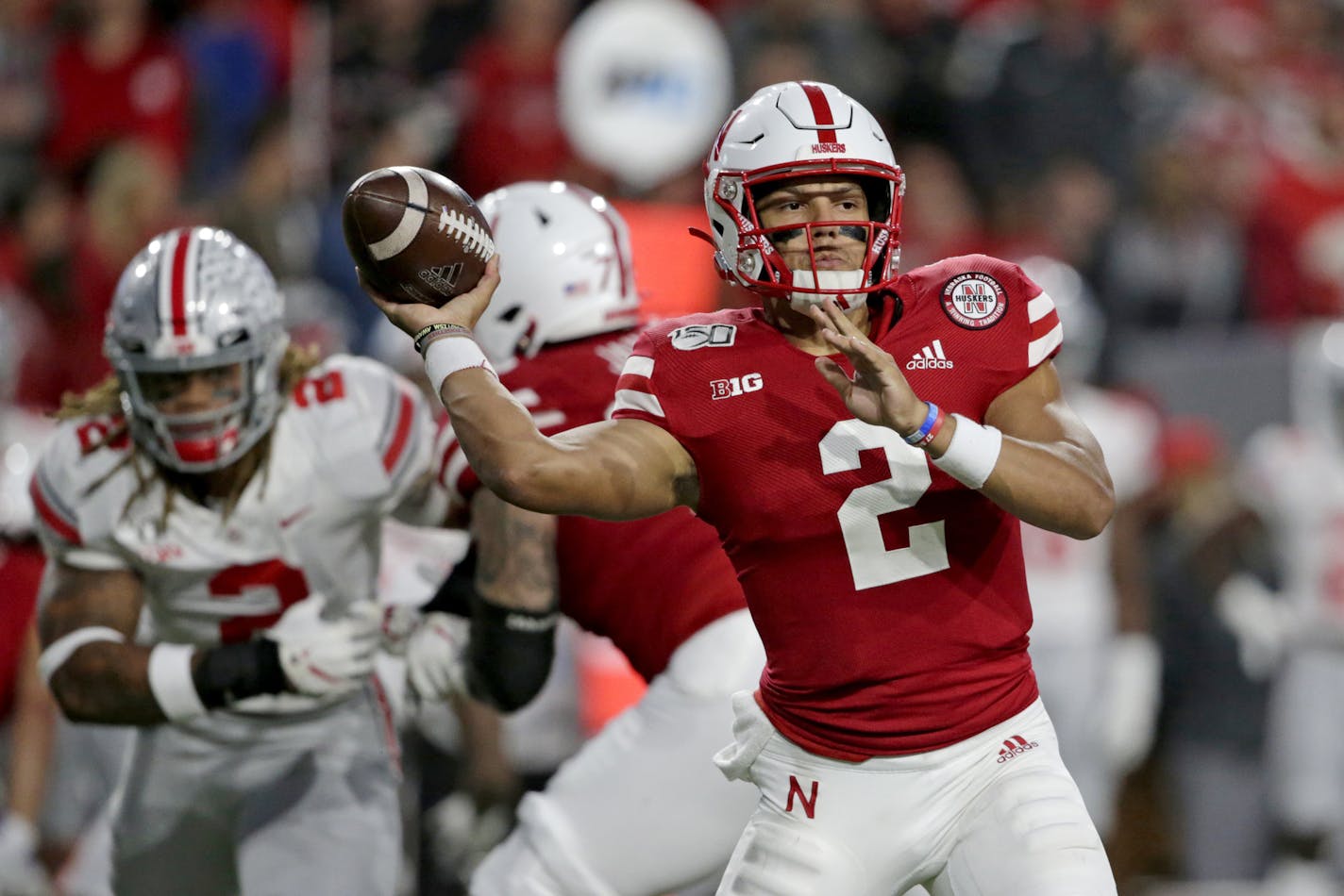 FILE - In this Sept. 28, 2019, file photo, Nebraska quarterback Adrian Martinez (2) throws a pass during the first half of an NCAA college football game against Ohio State, in Lincoln, Neb. Nebraska starts the week of its trip to unbeaten Minnesota facing uncertainty about the health of two of its top players, quarterback Adrian Martinez and receiver JD Spielman. (AP Photo/Nati Harnik, File)