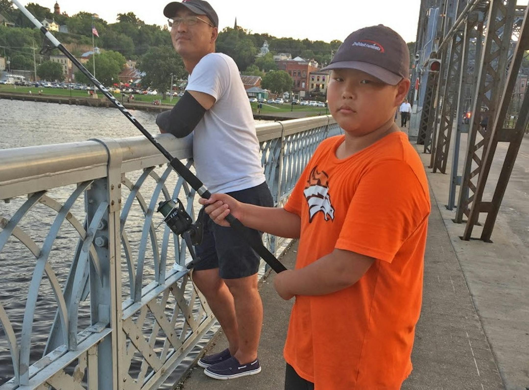 Jake Yang, back, and Steffen Yang enjoyed a pleasant Wednesday evening fishing from the Stillwater bridge, from which they’ve caught carp, catfish and other species.