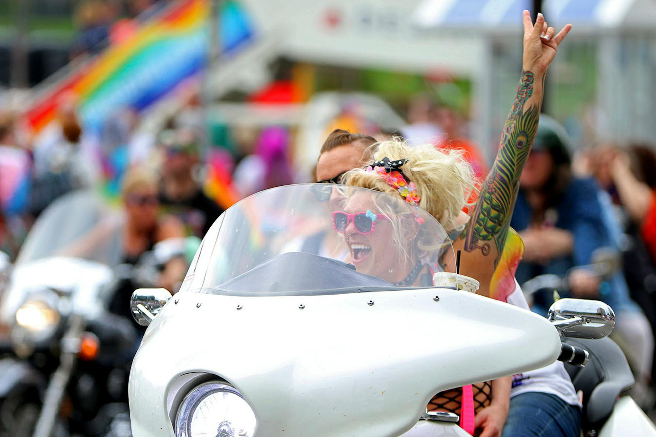 Phoenix Jeane raised her arm in excitement as the pride parade neared its launch.