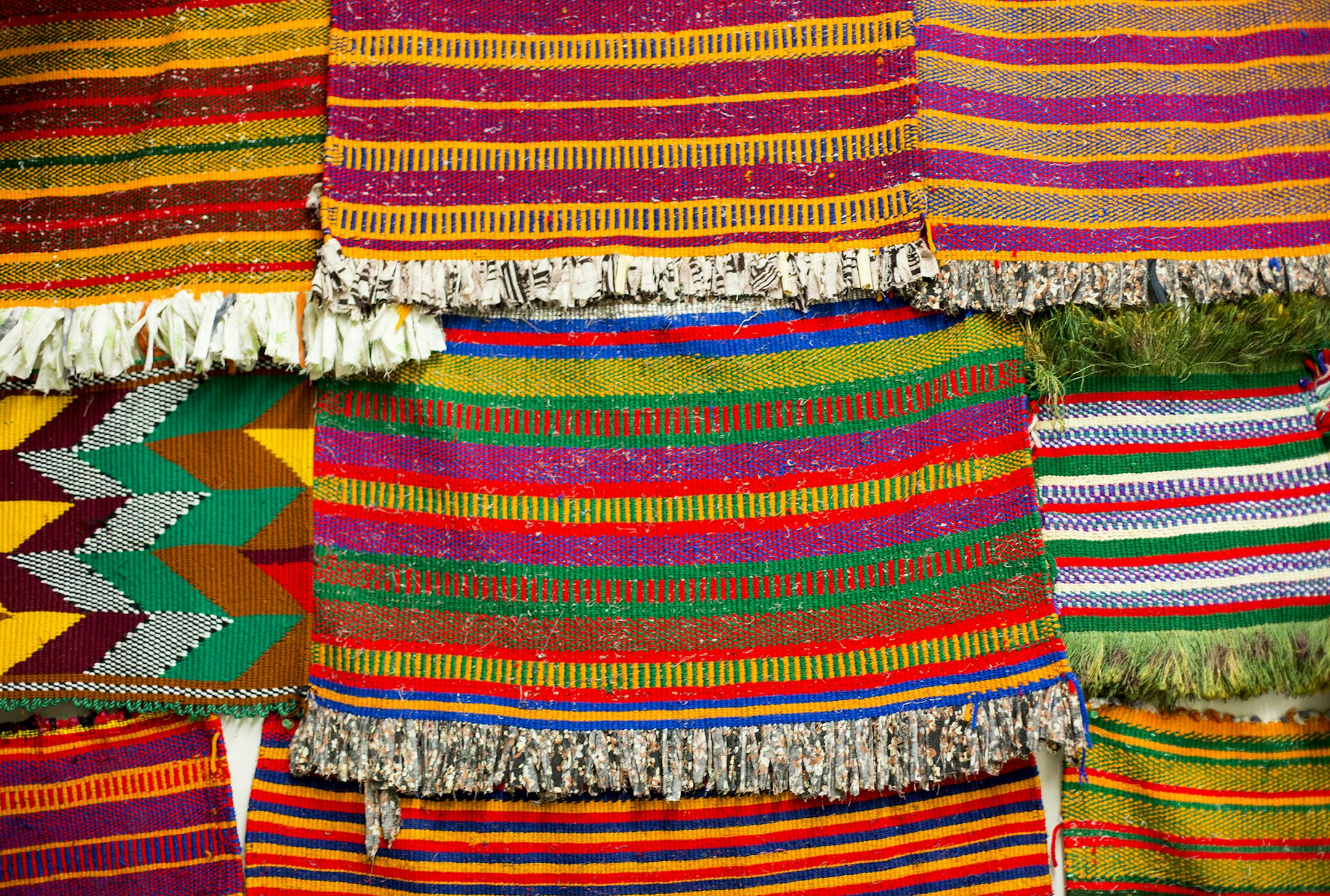 This is a selection of decorative mats, called kebdo, which are woven from cotton and used as decorations. Somalis + Minnesota at Minnesota History Center. Photo credit: Nikki Tundel