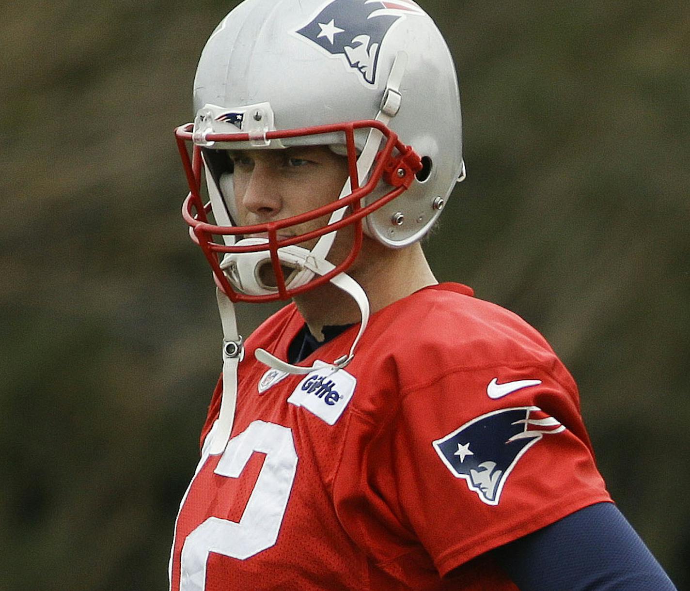 New England Patriots quarterback Tom Brady (12) stretches during practice Thursday, Jan. 29, 2015, in Tempe, Ariz. The Patriots play the Seattle Seahawks in NFL football Super Bowl XLIX Sunday, Feb. 1. (AP Photo/Mark Humphrey)