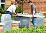 FILE - Workers remove a monument bearing the Ten Commandments outside West Union High School, Monday, June 9, 2003, in West Union, Ohio. Louisiana cou