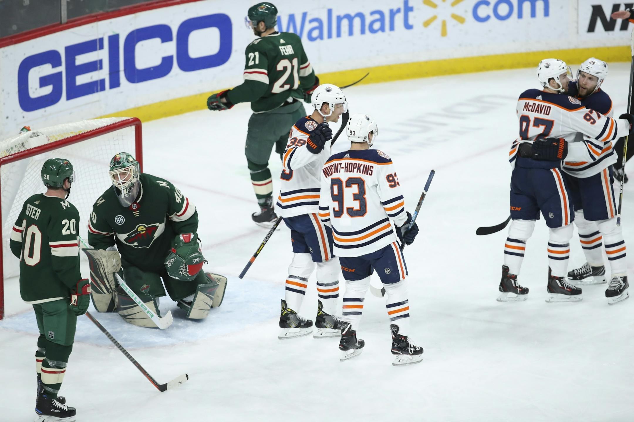 Edmonton Oilers center Leon Draisaitl (29), right, taunted Minnesota Wild defenseman Ryan Suter (20) after he scored his second goal of the game in the third period on a pass from right wing Alex Chiasson.