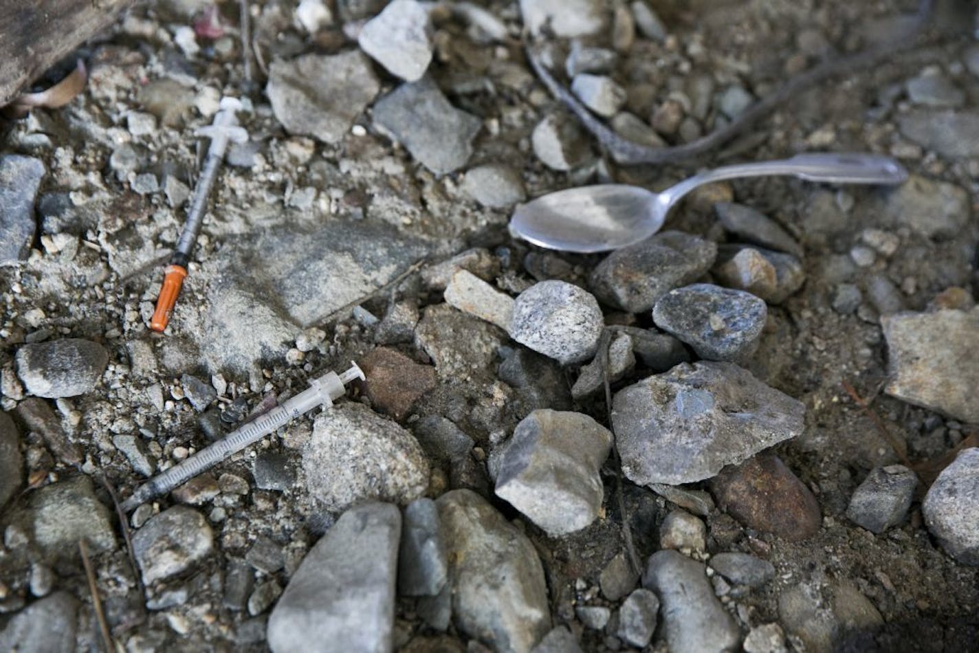 Needles scattered along the ground in a homeless encampment in Lawrence, Mass., March 12, 2016. Fentanyl, a potent and lethal cousin to heroin, is becoming the drug of choice for some addicts � and is killing them more quickly.