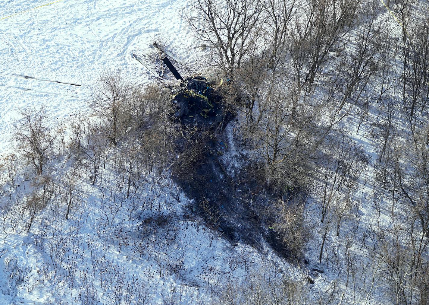 The crash site of a Minnesota National Guard Black Hawk helicopter that killed three service members Thursday afternoon was found in the trees on the edge of a farm field southwest of Marty, Minn.