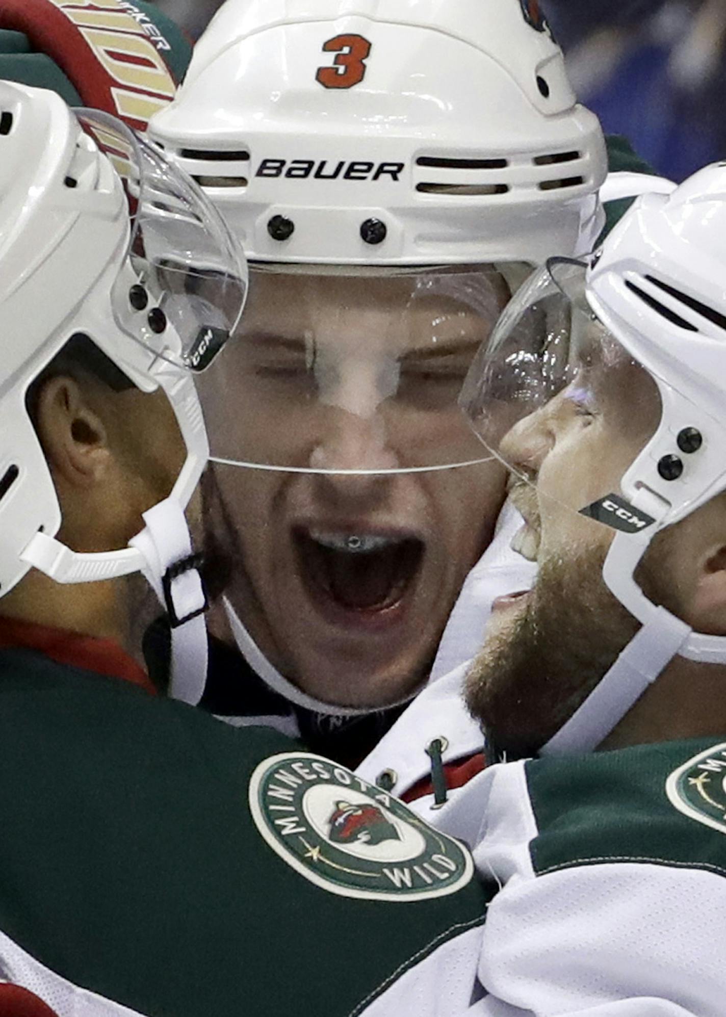 Minnesota Wild's Charlie Coyle, center, is congratulated by teammates Matt Dumba, left, and Jason Zucker after scoring during the third period of an NHL hockey game against St. Louis Blues, Thursday, Oct. 13, 2016, in St. Louis. (AP Photo/Jeff Roberson) ORG XMIT: MIN2016110419390255