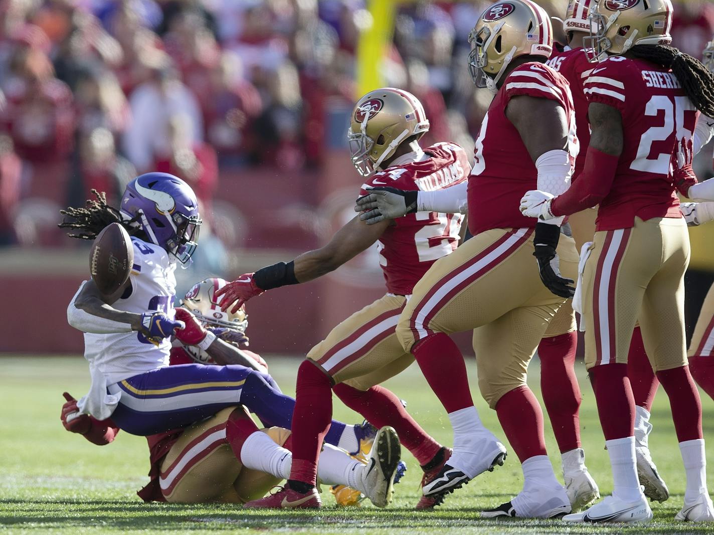 Minnesota Vikings running back Dalvin Cook (33) was tacked for no gain in the first quarter by San Francisco 49ers linebacker Dre Greenlaw (57) .