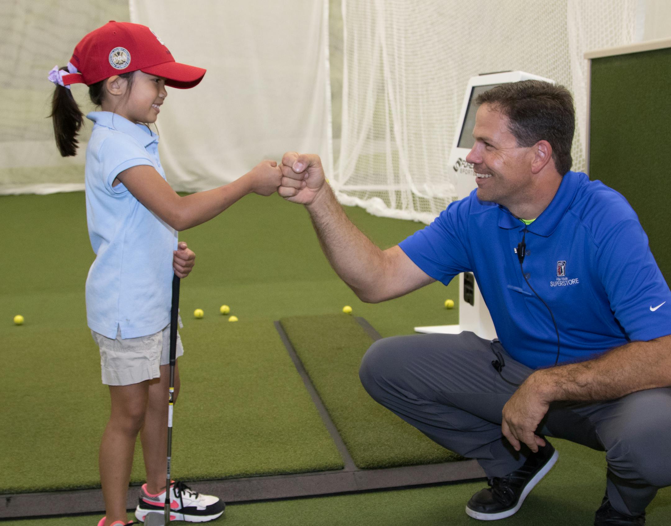 Abigail Labrador receives a lesson from the PGA Tour Superstore's Trey Cherry at the ribbon cutting ceremony of the PGA Tour Superstore on June 9, 2016 at the PGA Tour Superstore in Minnetonka, Minn. ] Special to Star Tribune, Matt Blewett | matt@mattebphoto.com, Matte B Photography, PGA Tour Superstore, FACE062816 Saxo 846516