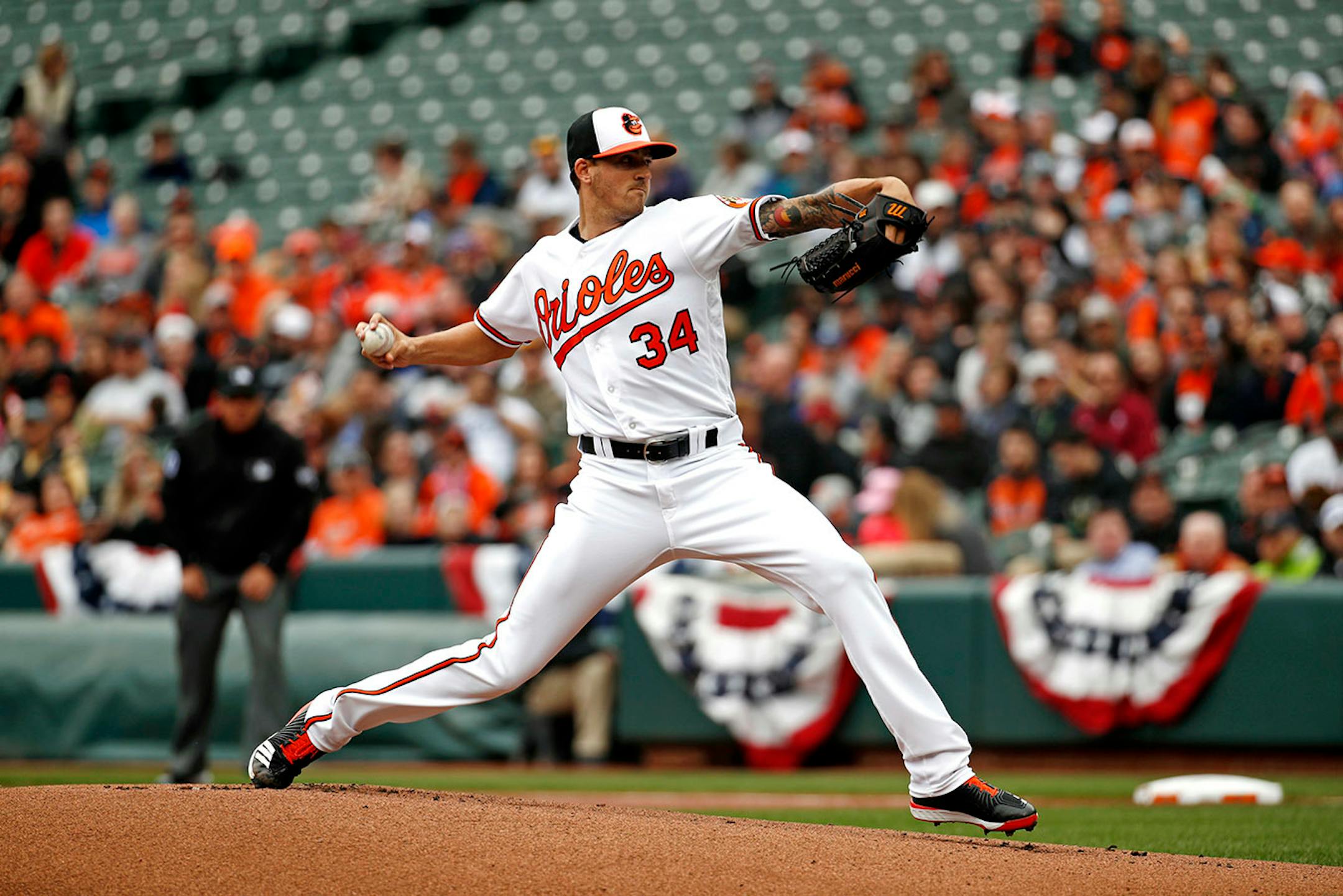 Baltimore Orioles starting pitcher Kevin Gausman throws to the Minnesota Twins in the first inning of a baseball game Sunday, April 1, 2018, in Baltimore.